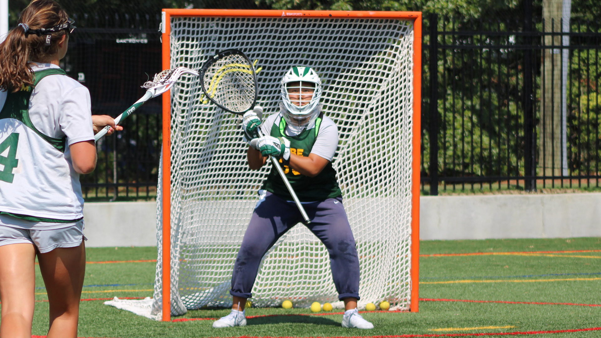 Chelsea Kim prepares to make a save during practice