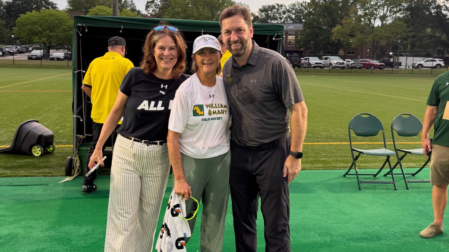 Brian Mann, Tess Ellis and Katherine Rowe pose following Ellis' 100th career victory
