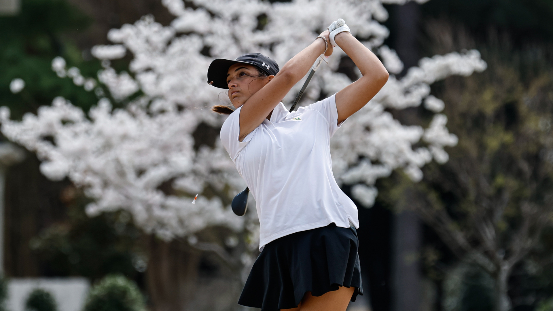 Jennifer Osborne finishing a golf swing during a tournament at Kingsmill