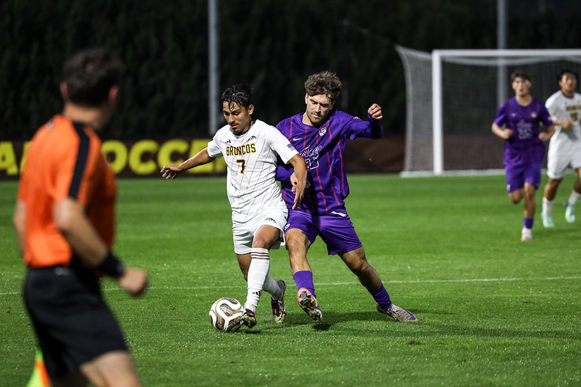 Midfielder Gabe Villagomez tries to go for the soccer ball while being closely defended by an Evansville midfielder