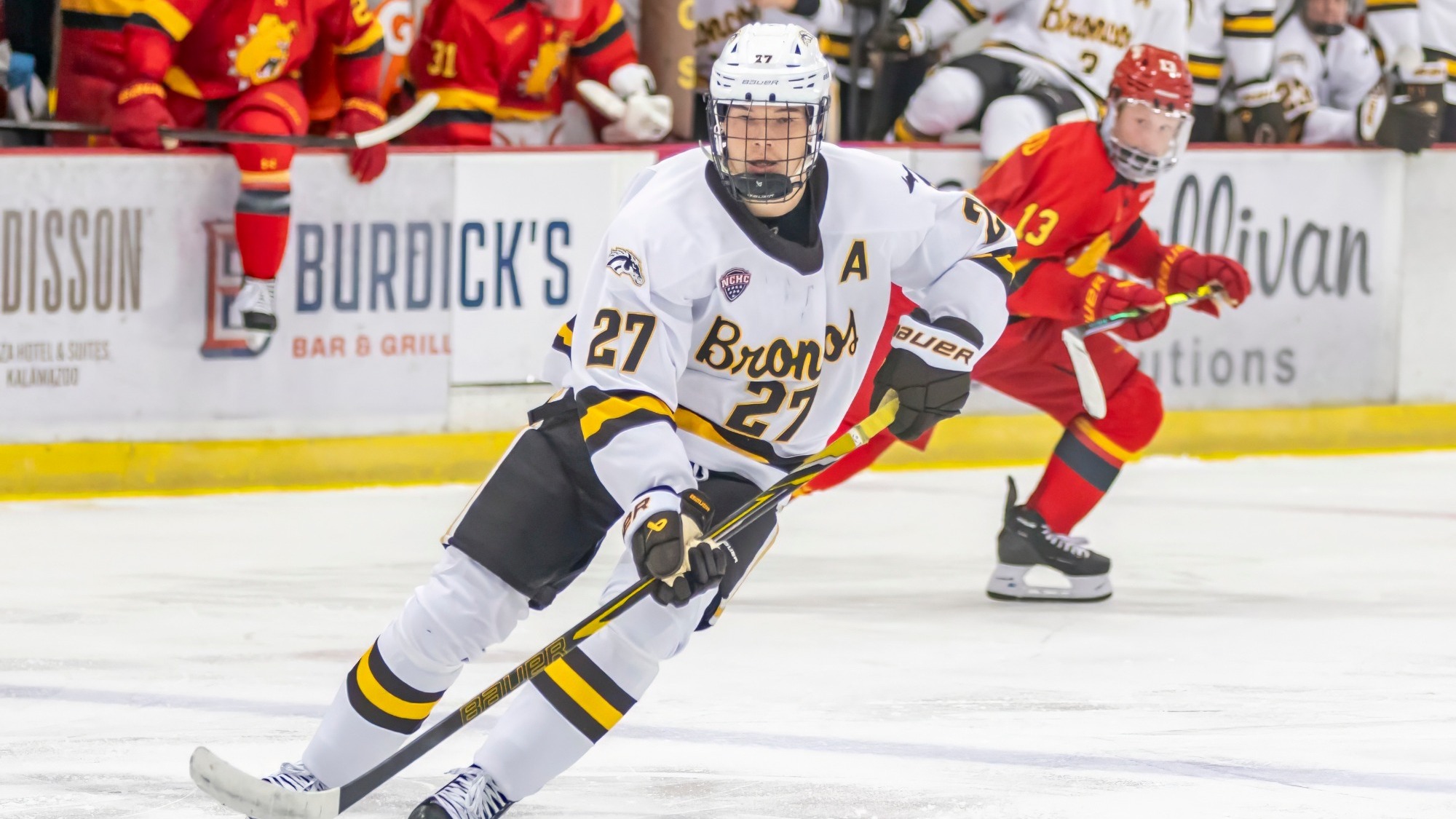 Joona Väisäanen carries the puck up ice against Ferris State