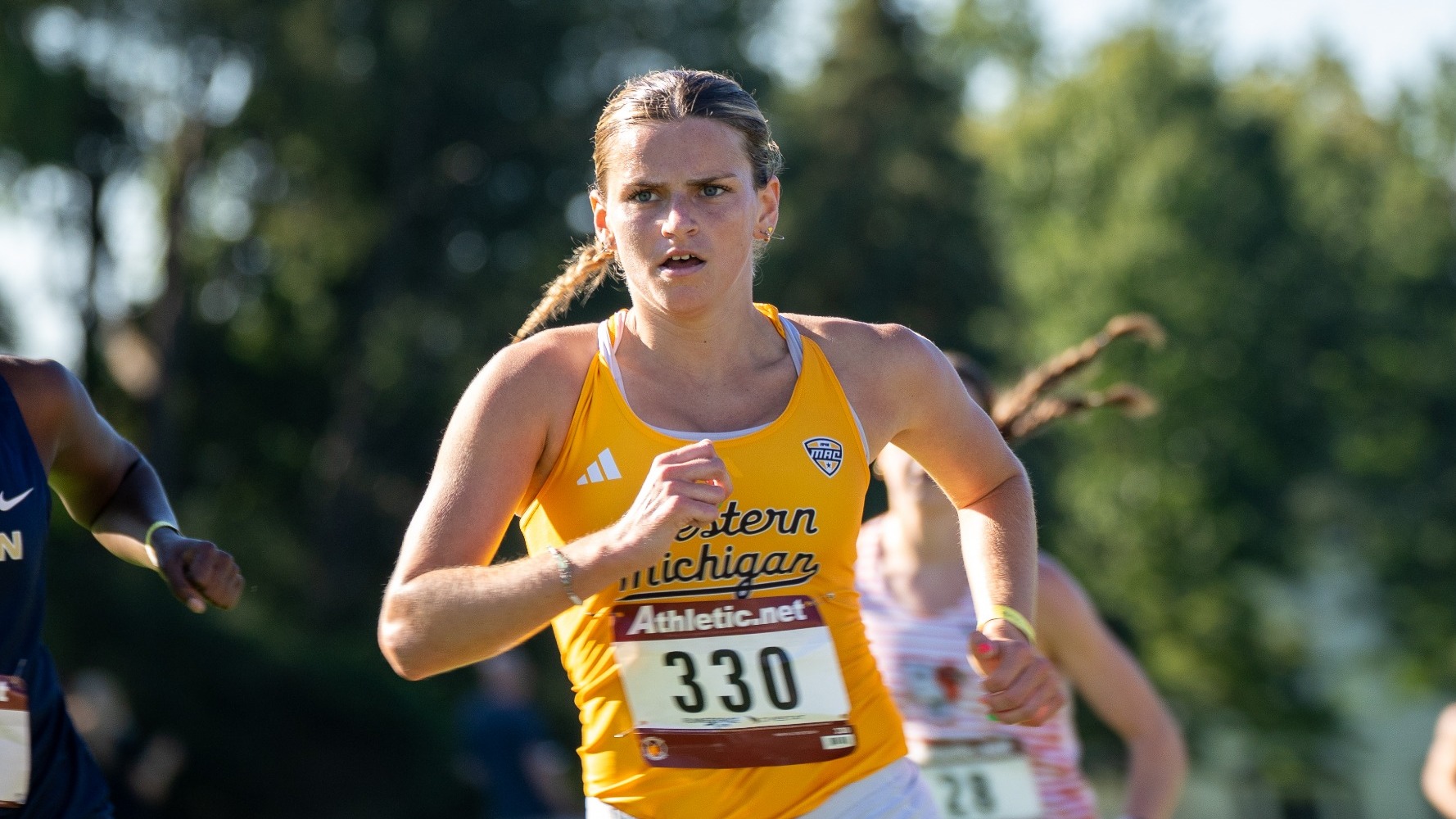 Lily Overton racing toward a third-place finish at the 2026 George Dales Invite