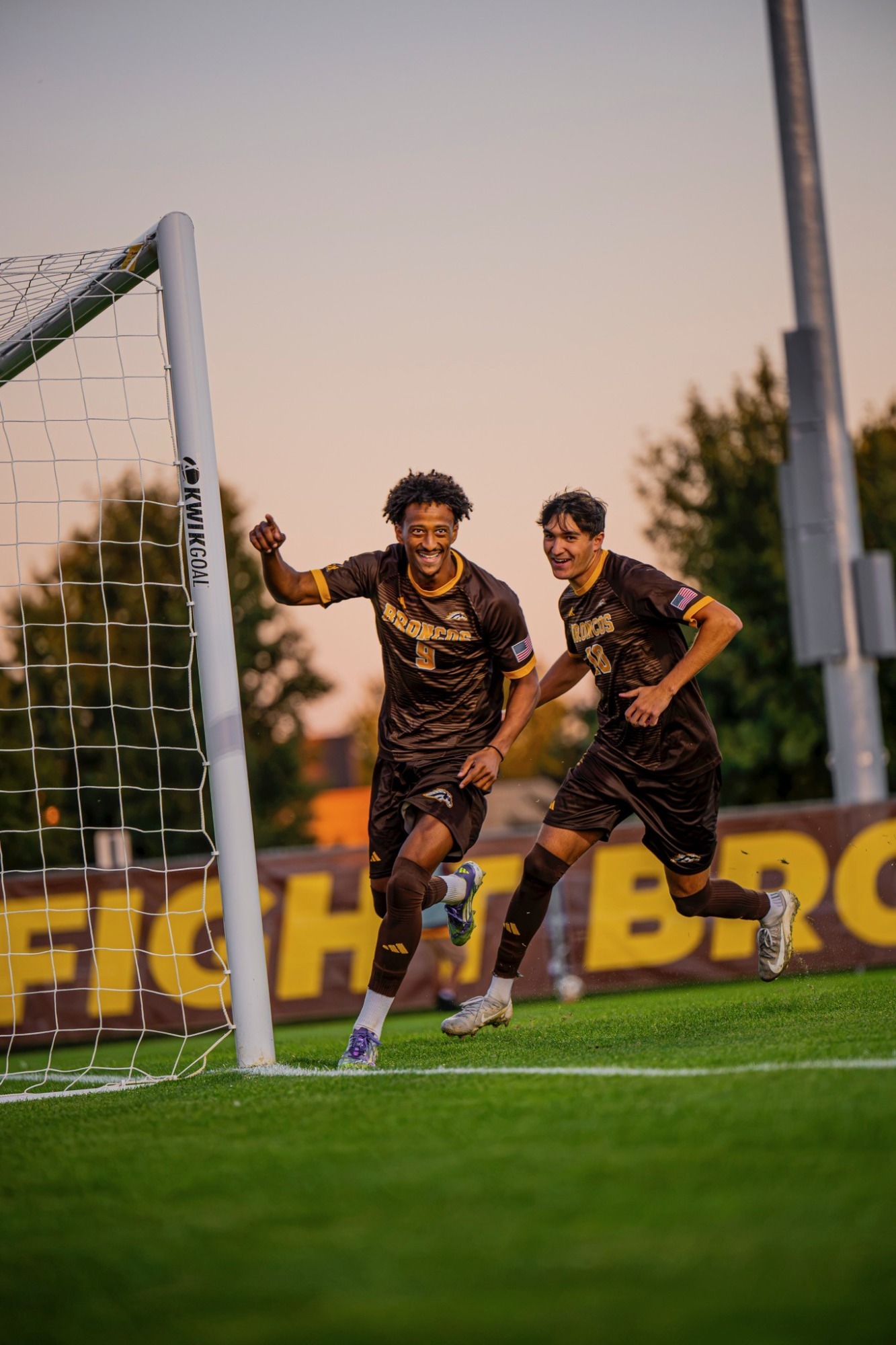 Forwards Sahel Yessen and Vitor Geromel celebrate after scoring a penalty kick goal