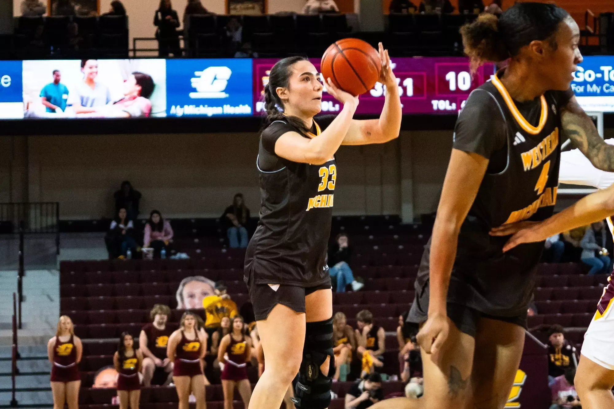 Nile Muguira makes a three point shot at Central Michigan 
