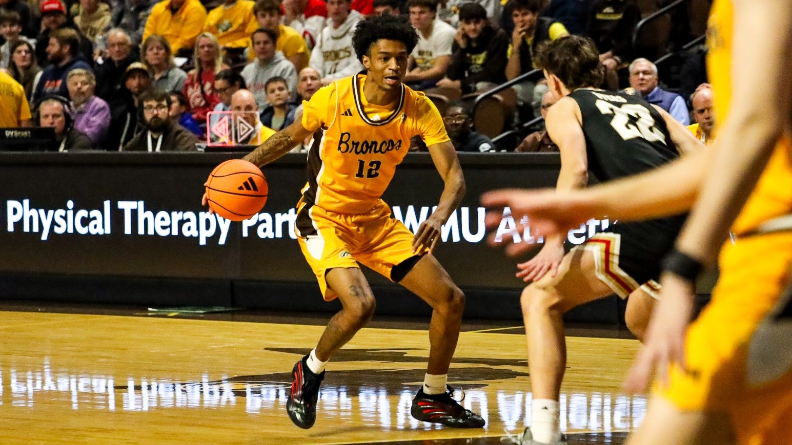 Jayden Brewer looks to drive against #21 Miami