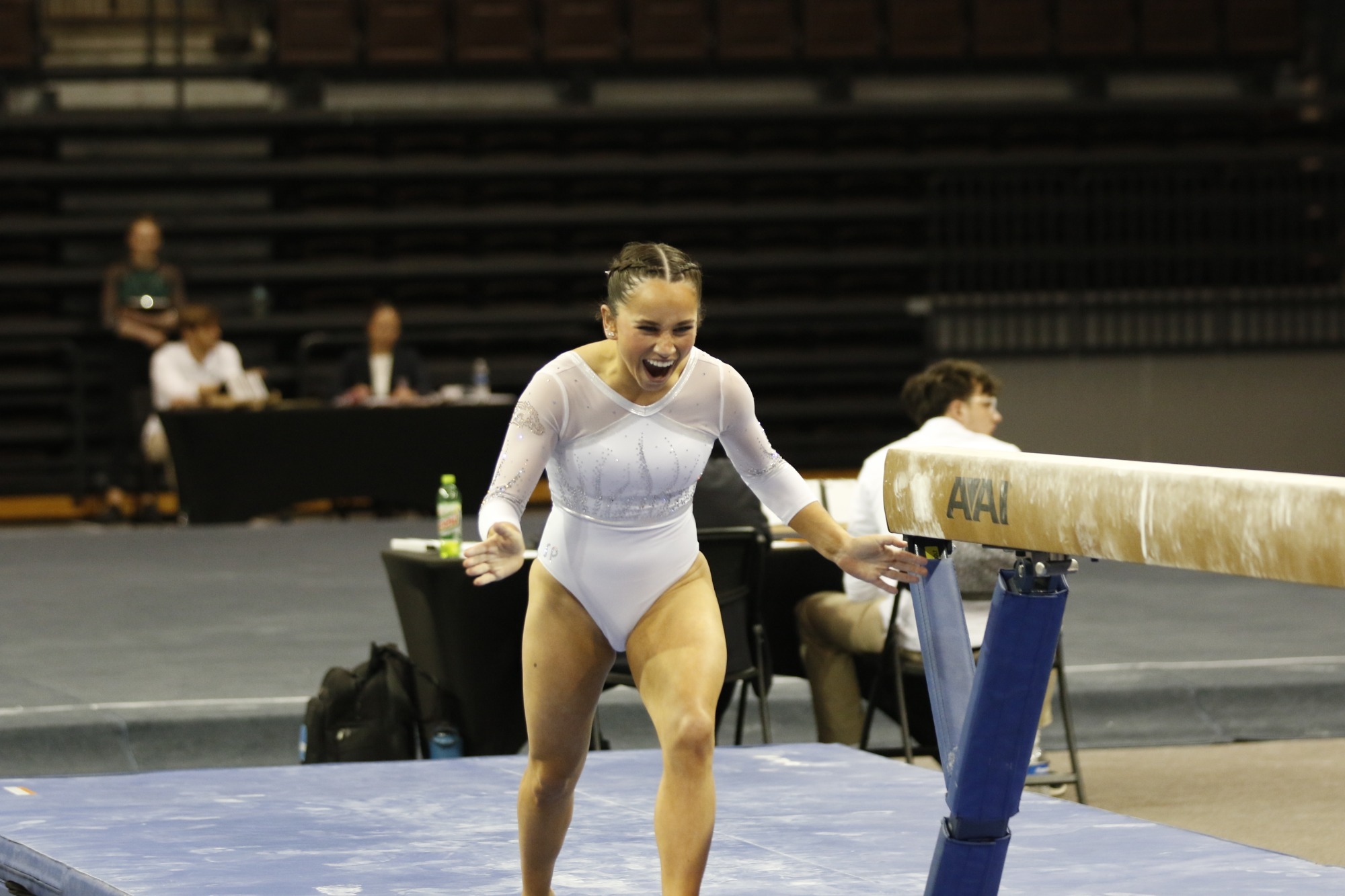 Bella Ciolfi celebrates her dismount on beam. 