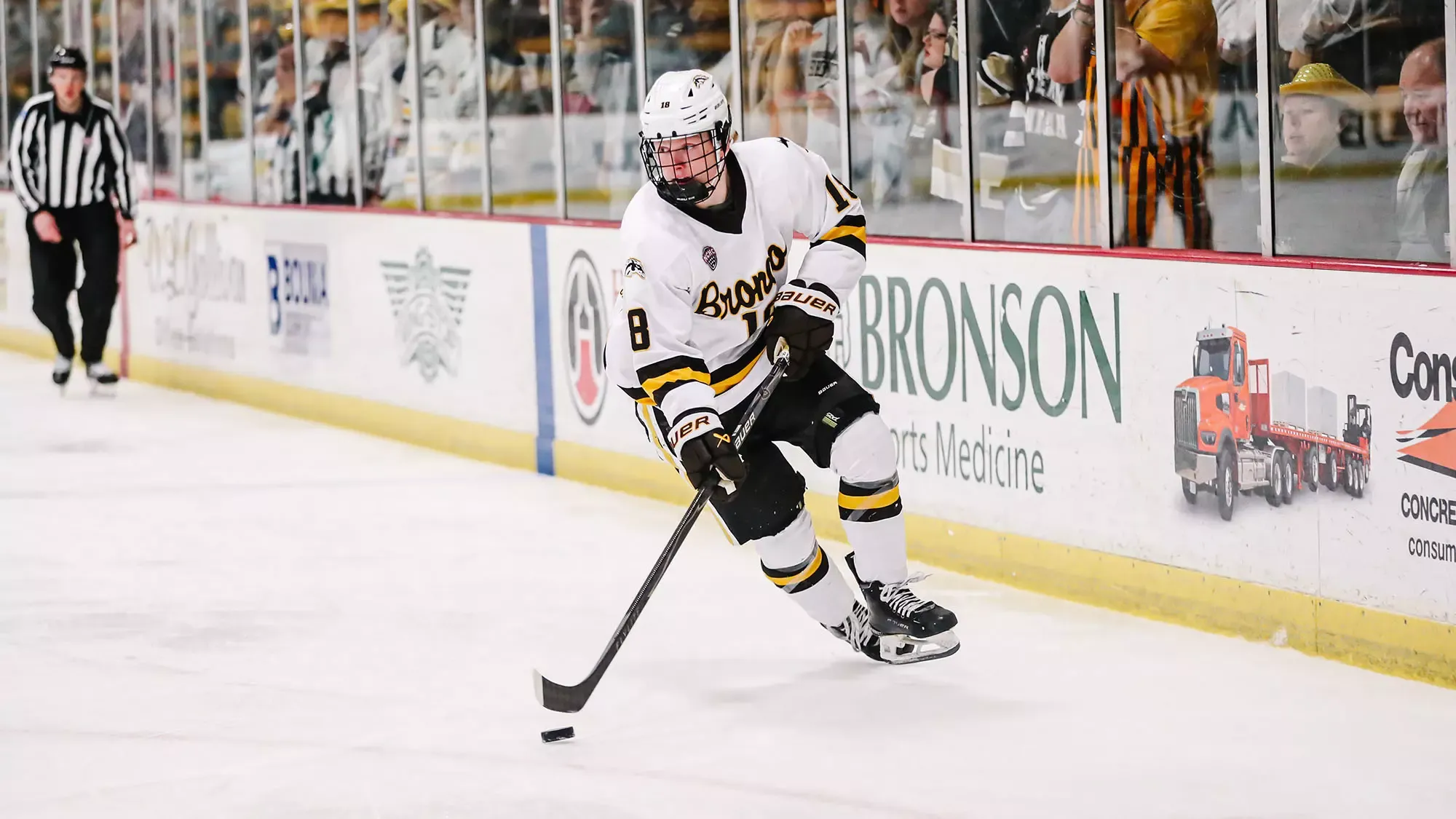 Whitelaw carries the puck in.