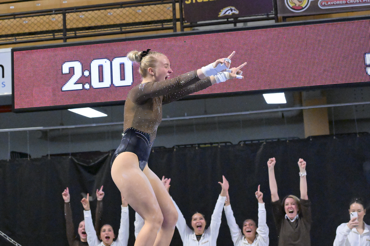 Reese Samuelson sticks her landong on bars.