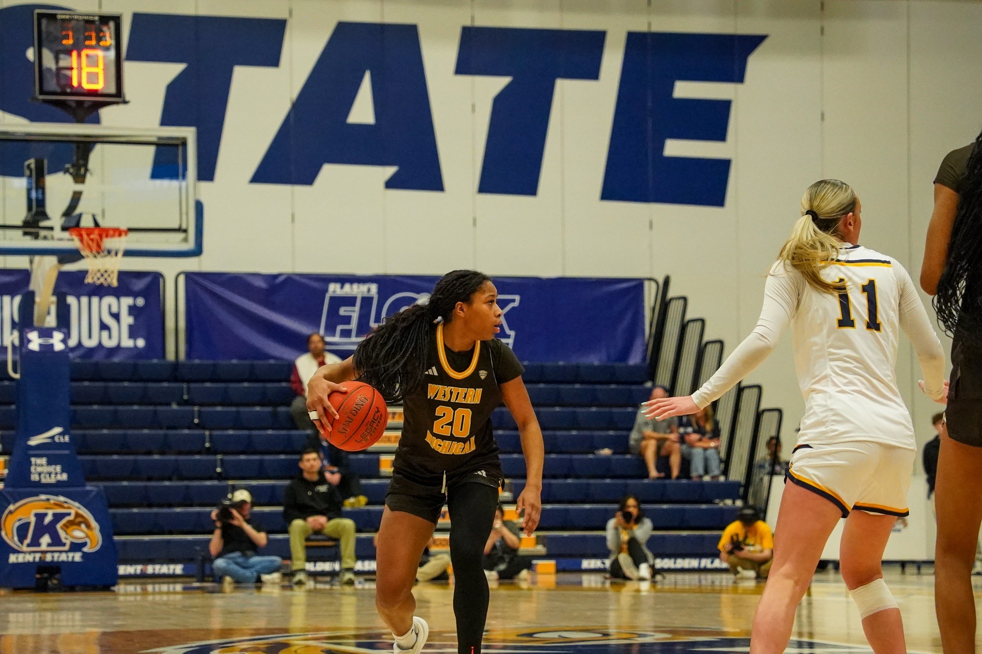 Kailey Starks holds the ball and looks to the right sideline at Kent State