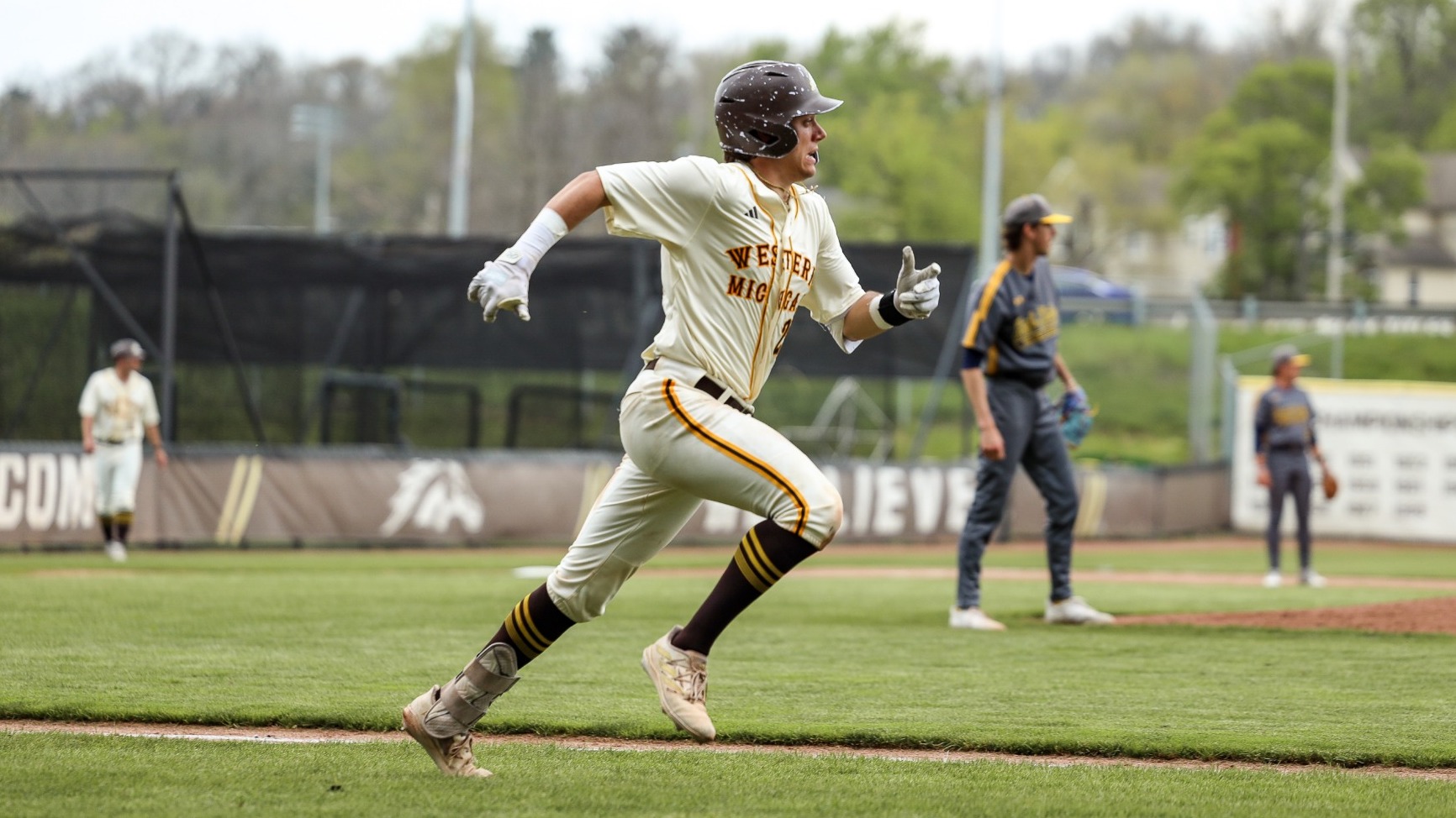 Nolan Zajac hustles down the line to first base