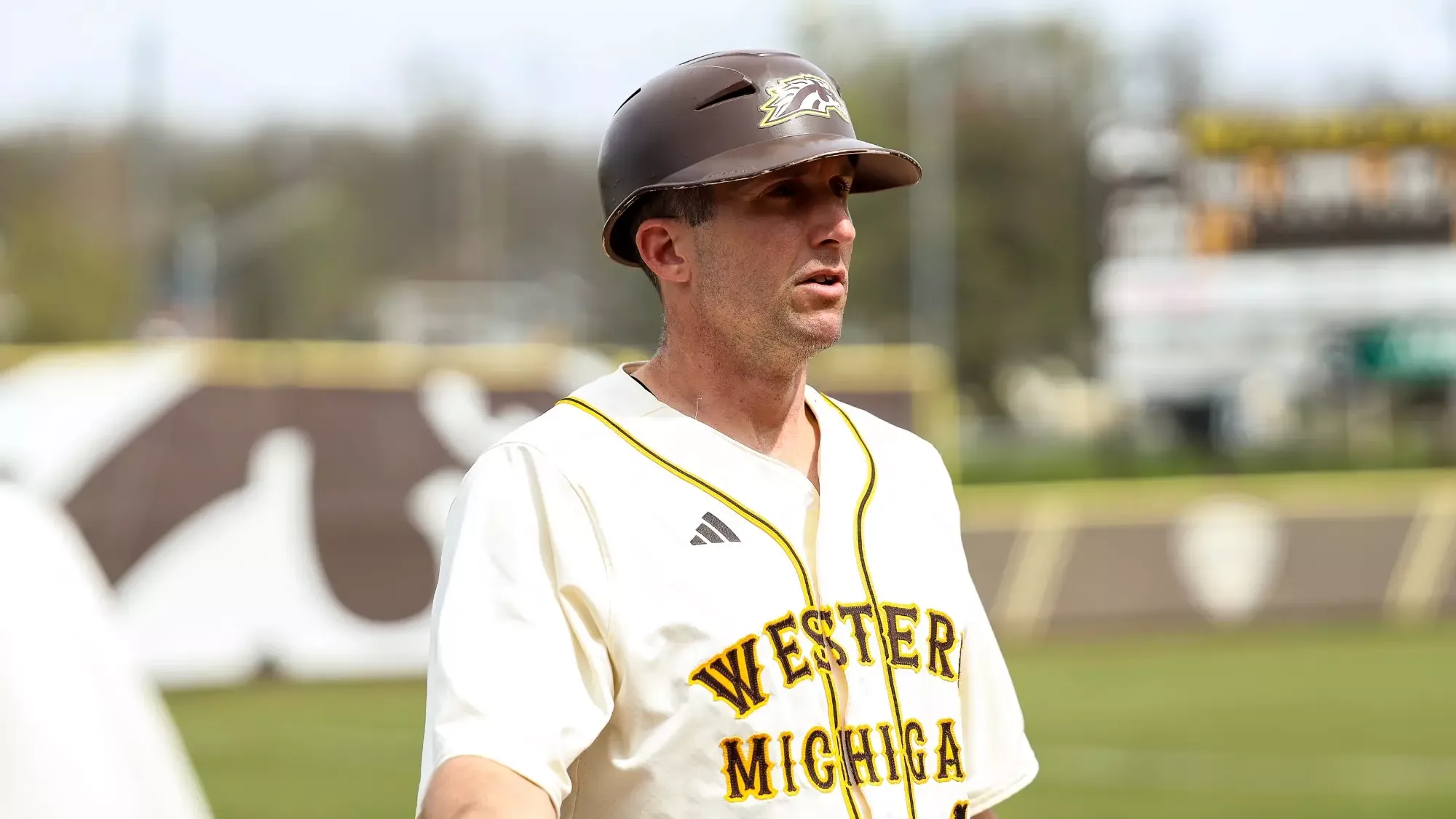 WMU assistant coach Josh Rebandt in the third base coaching box