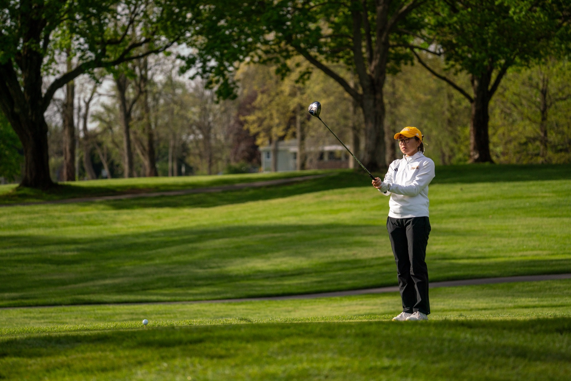 Danielle Daniy lines up a drive at the 2026 MAC Championships second round