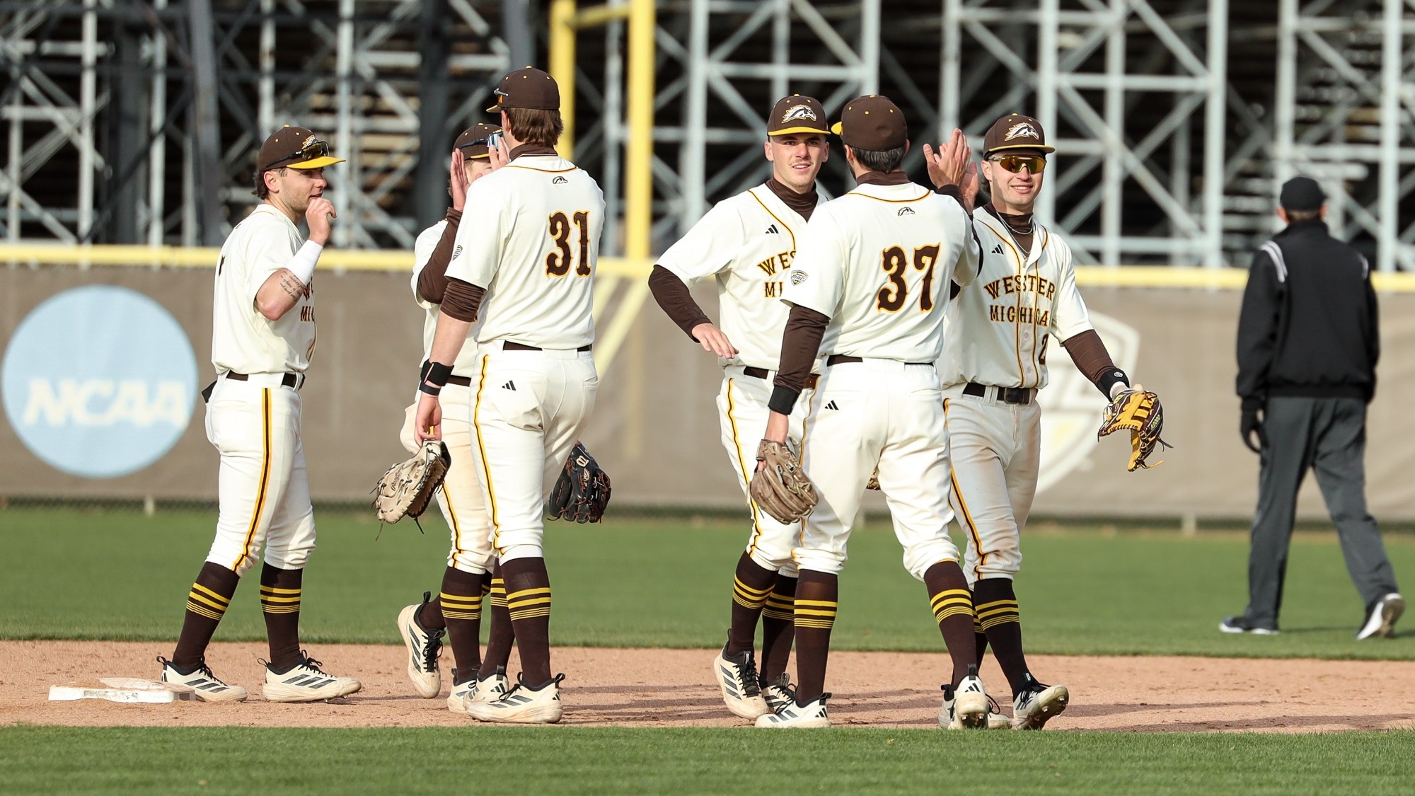The Broncos high-five after their victory over Valparaiso