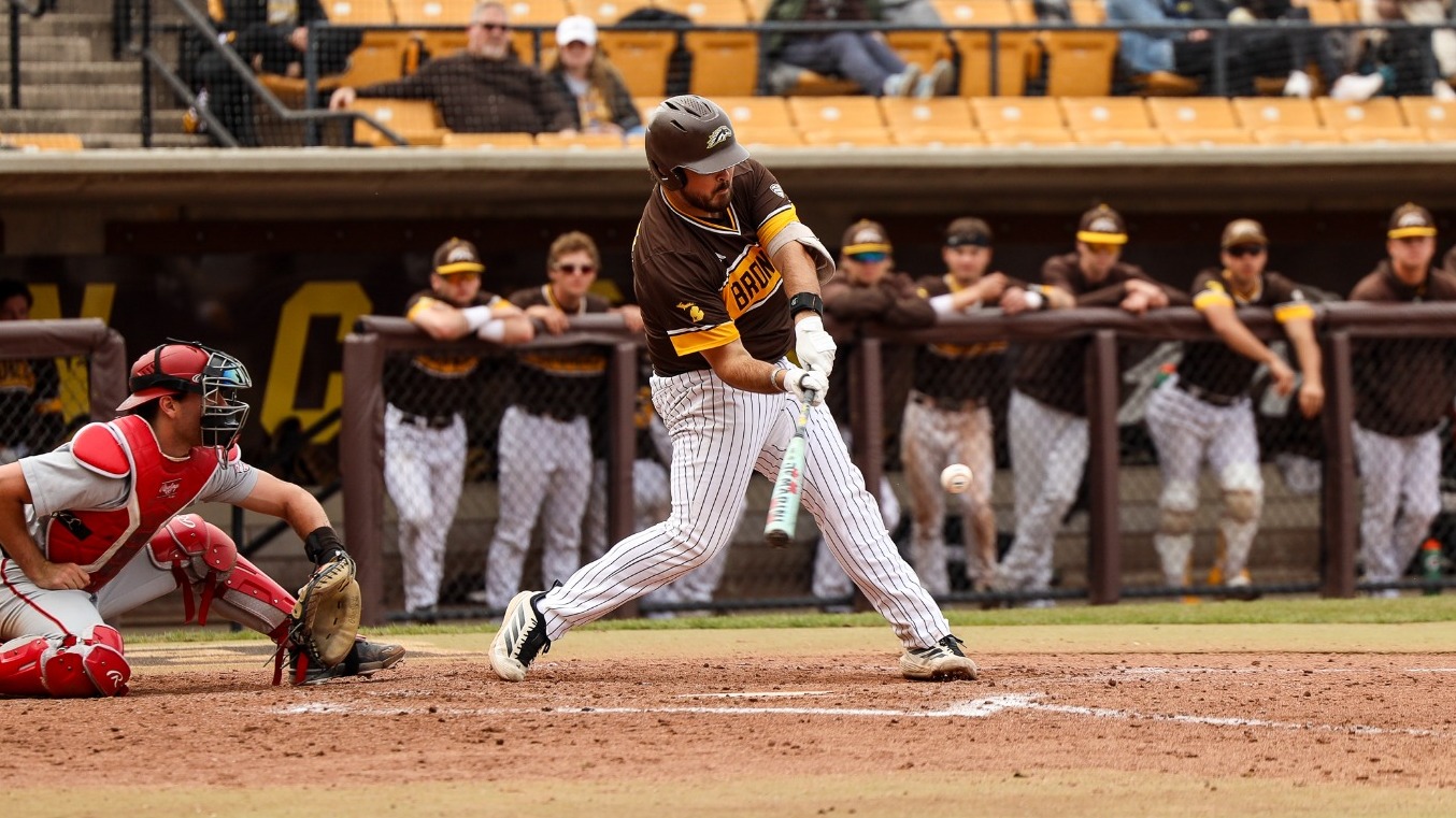 Lucas Rick takes a swing against Ball State