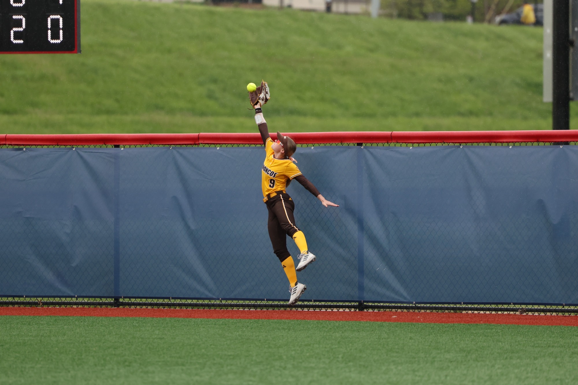 Megan Malartsik leaps up to grab a potential home run from Akron at the 2026 MAC Tournament