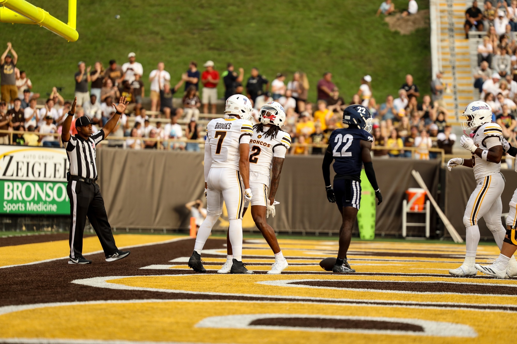 Baylin Brooks and Aveion Chenault celebrate a Bronco touchdown. 