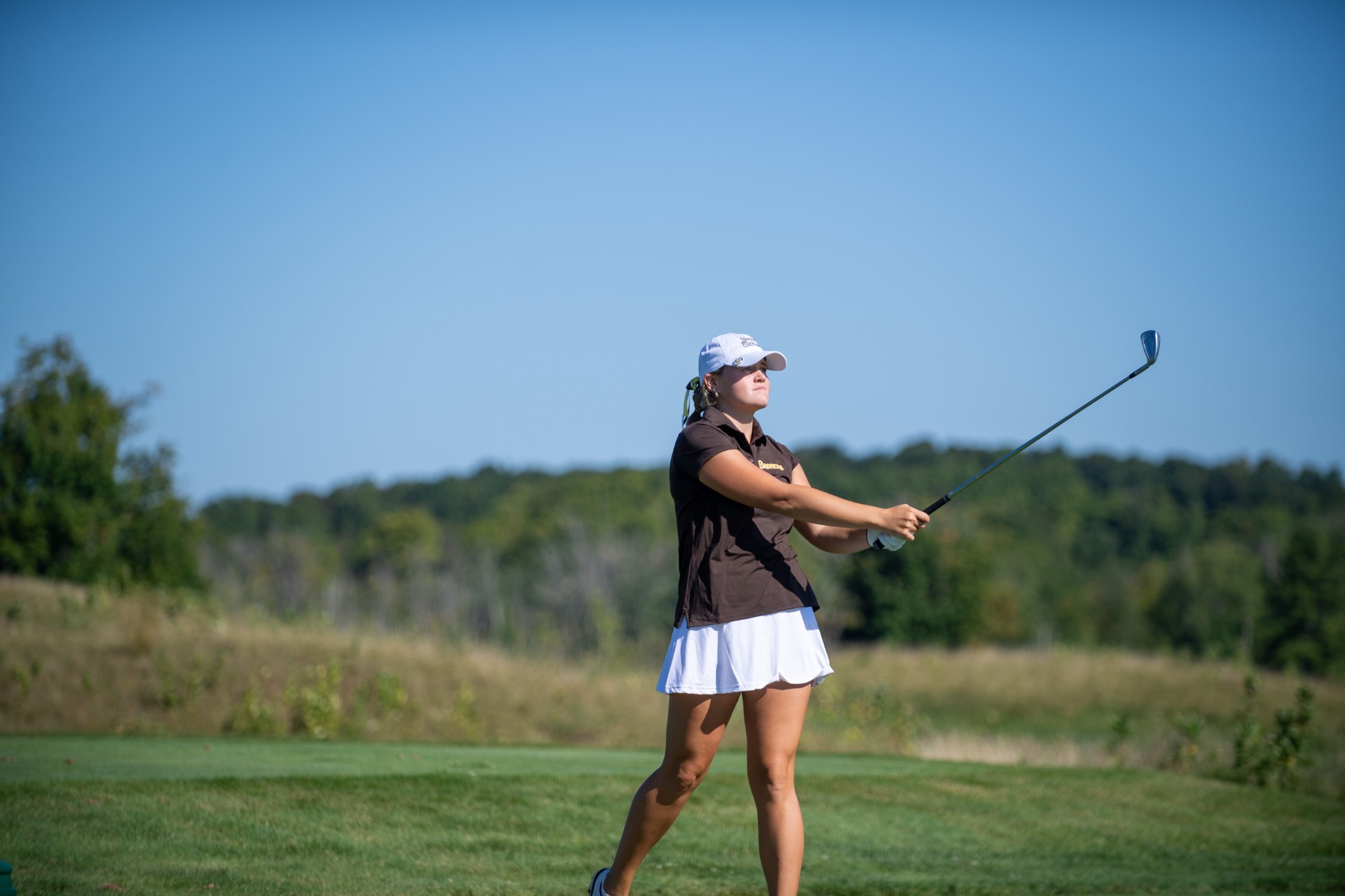 Lauren Lupinek watches a drive at the A-Ga-Ming Invitational