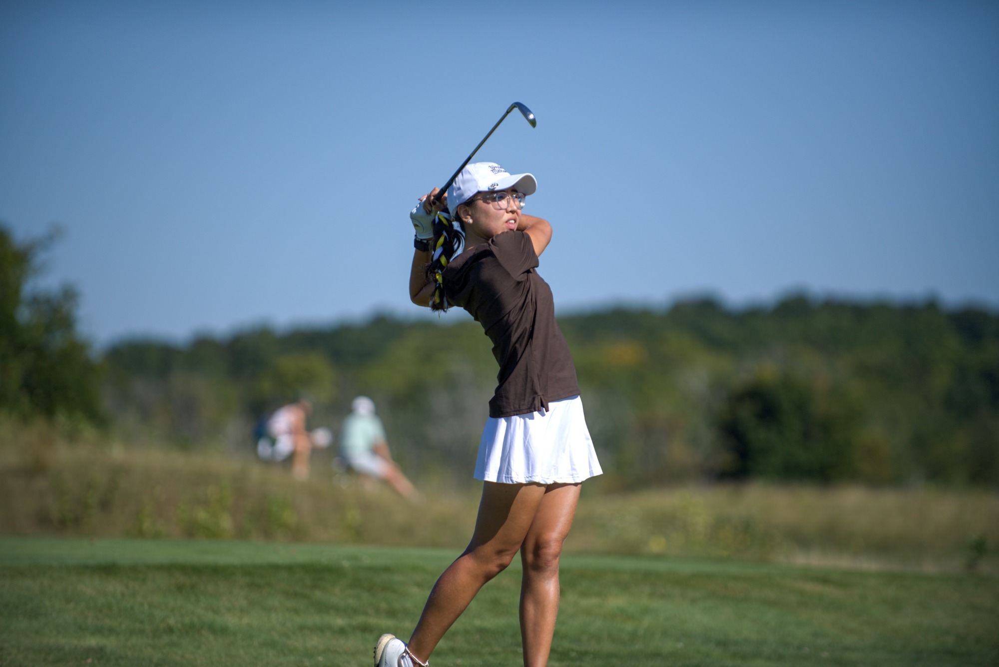 Danielle Daniy finishes an iron shot at the A-Ga-Ming Invitational