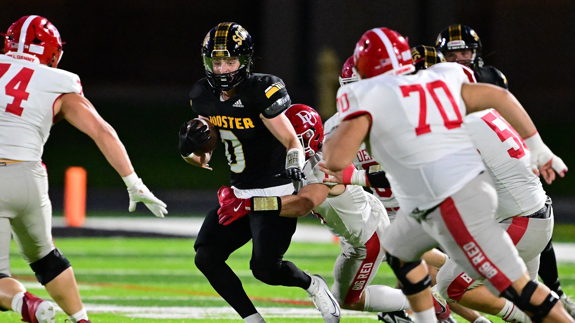 Charlie Scoggin returns an interception against Denison in a 2025 game.