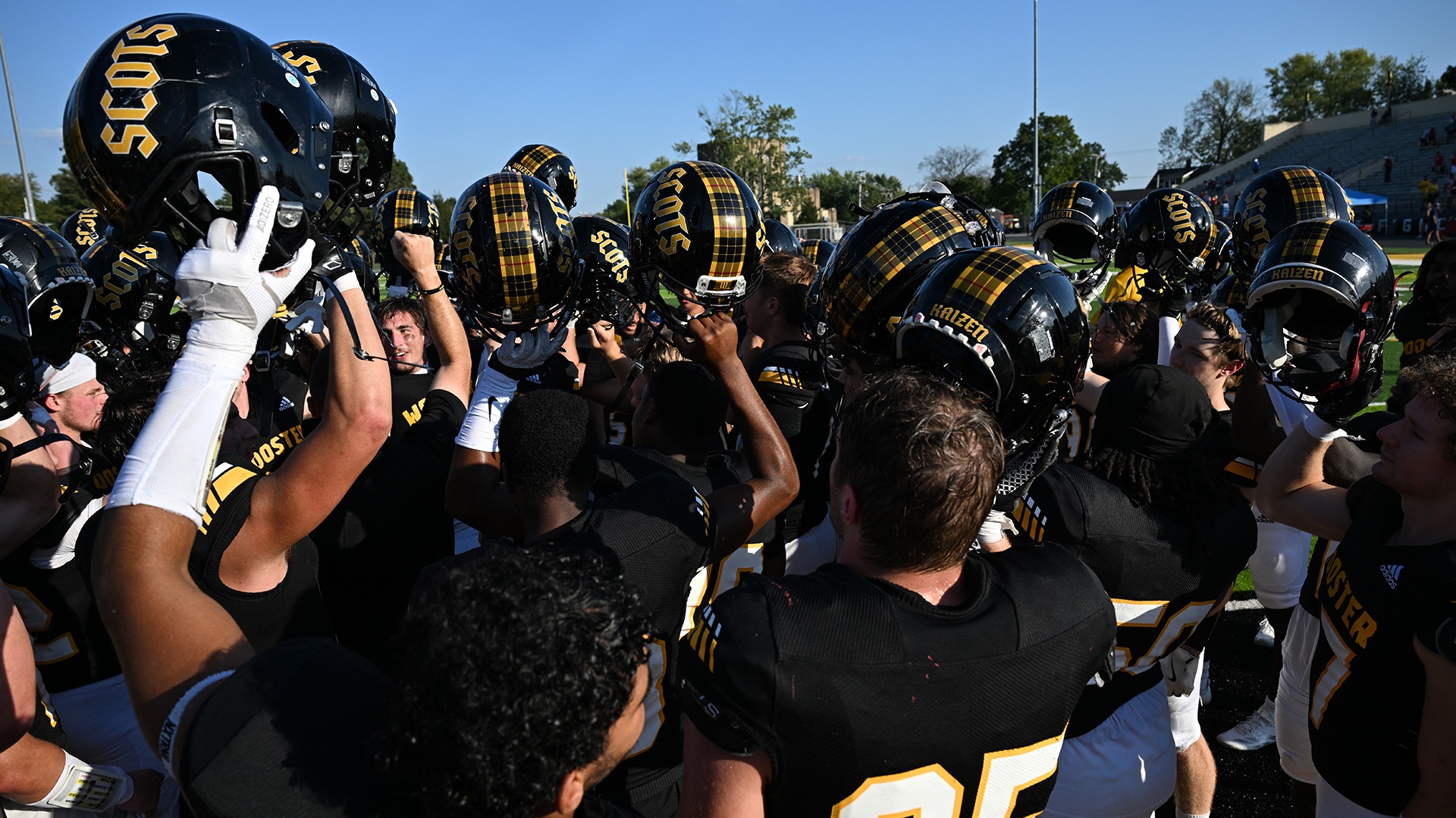 Wooster football celebrates its 14-12 win over Wittenberg in 2025.