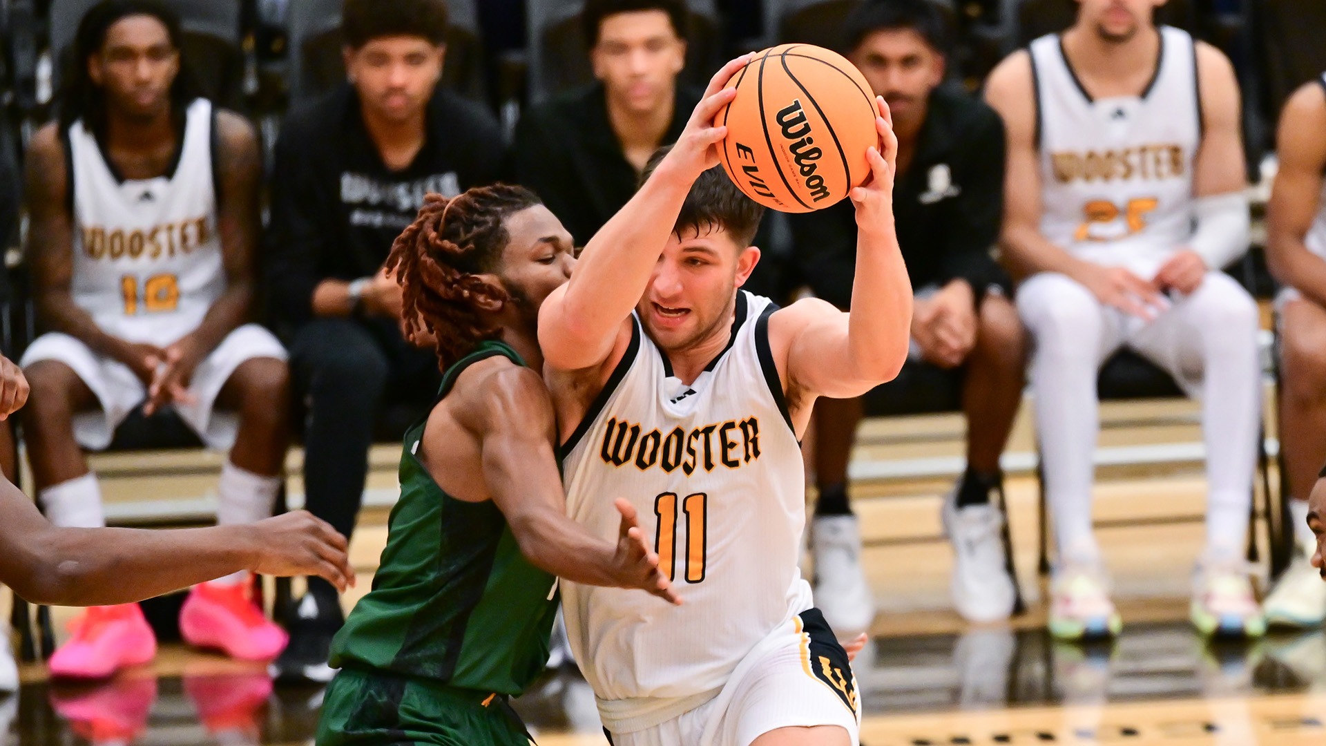 Isaac Roeder drives to the basket in a 2025 game against SUNY Brockport.