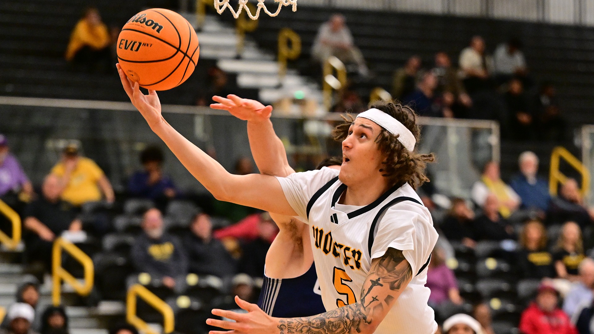 Si Kielian drives in for a layup against Geneseo in a 2025 game