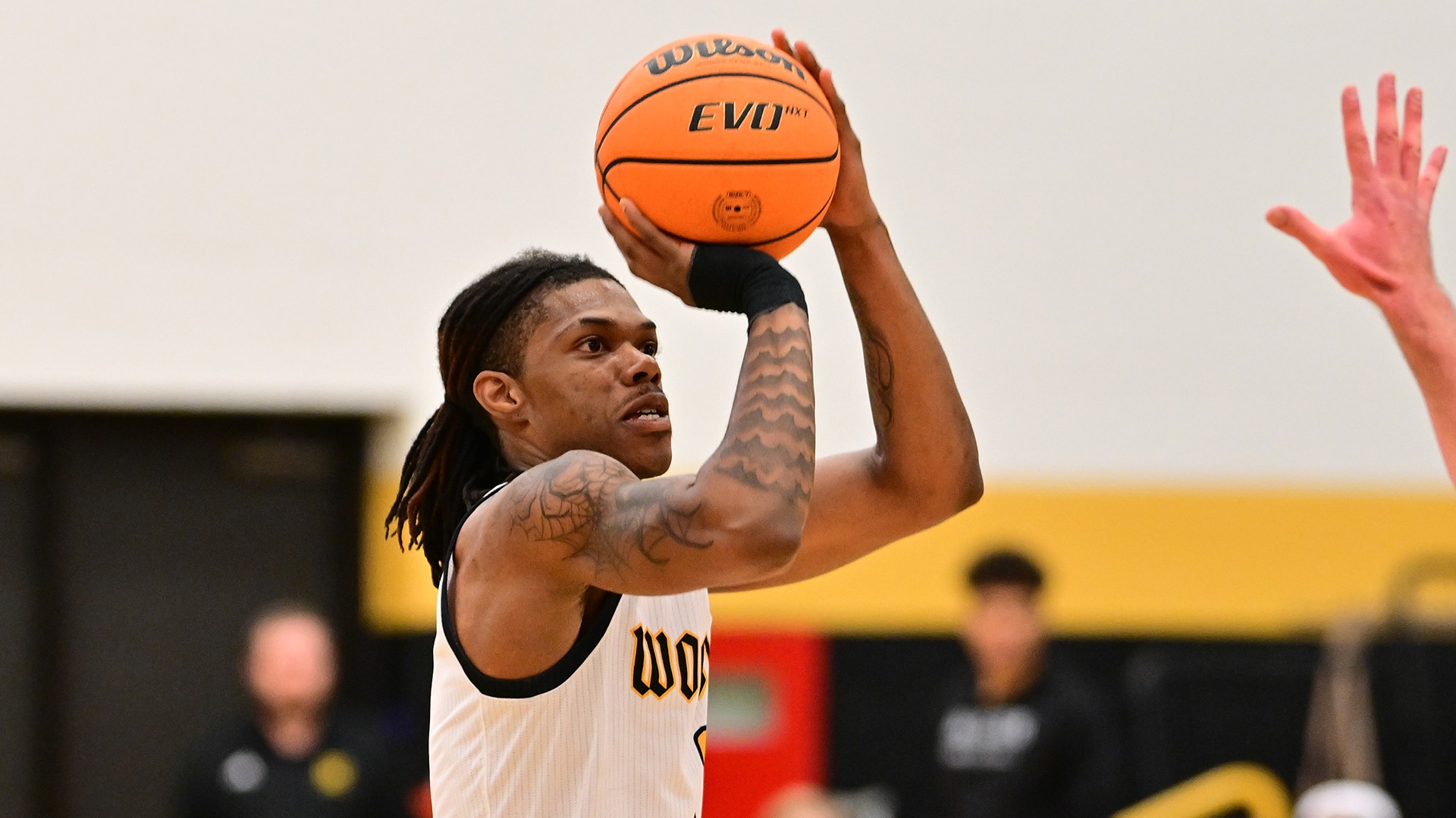 Jaiden Cox-Holloway shoots a 3-pointer against John Carroll in a 2025 game
