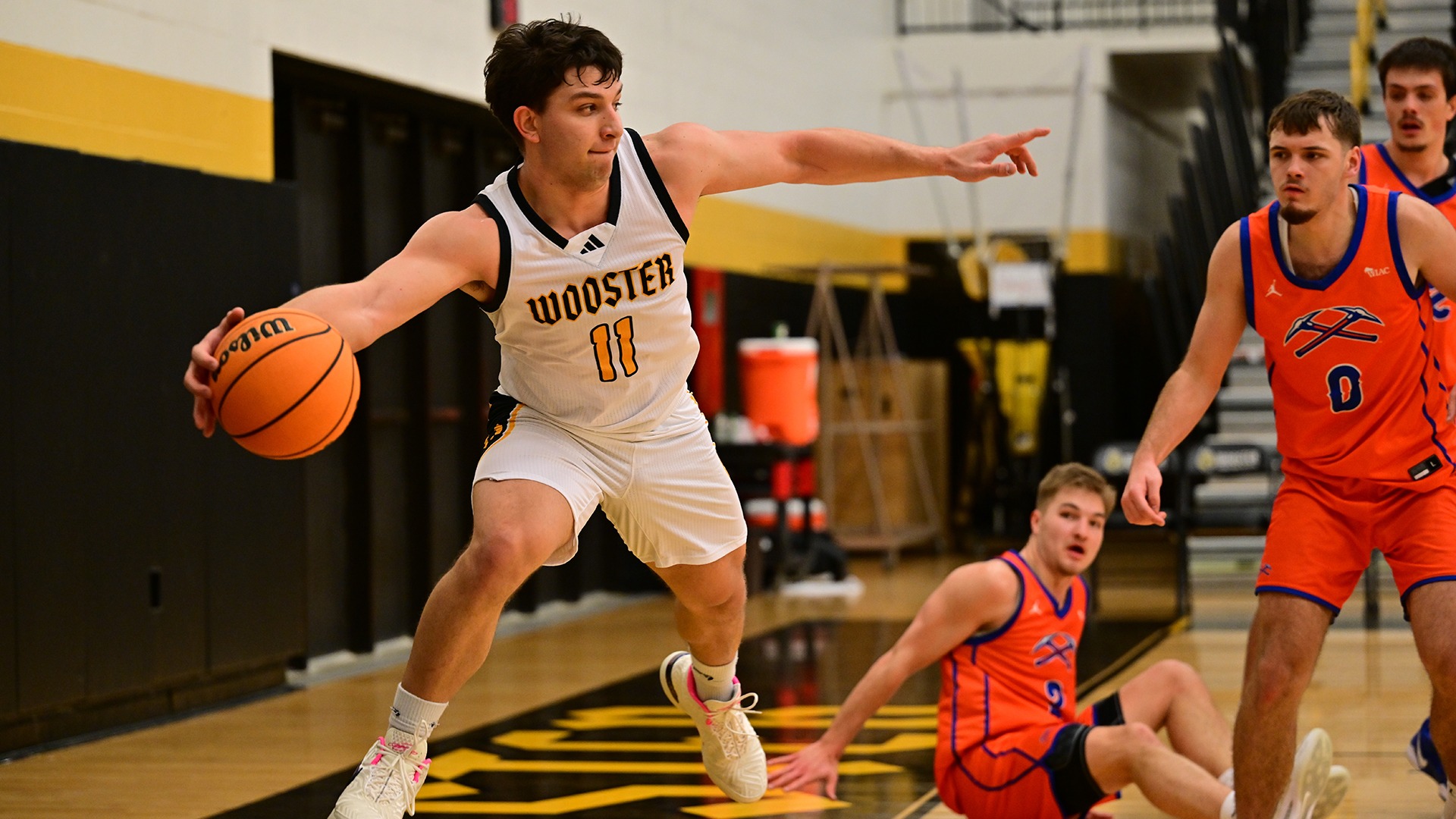 Isaac Roeder looks to keep the ball with Wooster in a 2025 game against Platteville