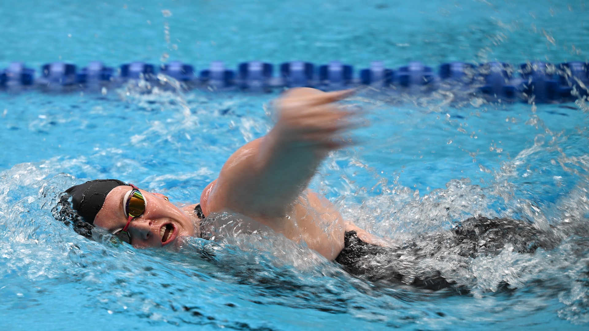 An unknown Wooster swimmer in the freestyle during the 2025 Wooster Invitational