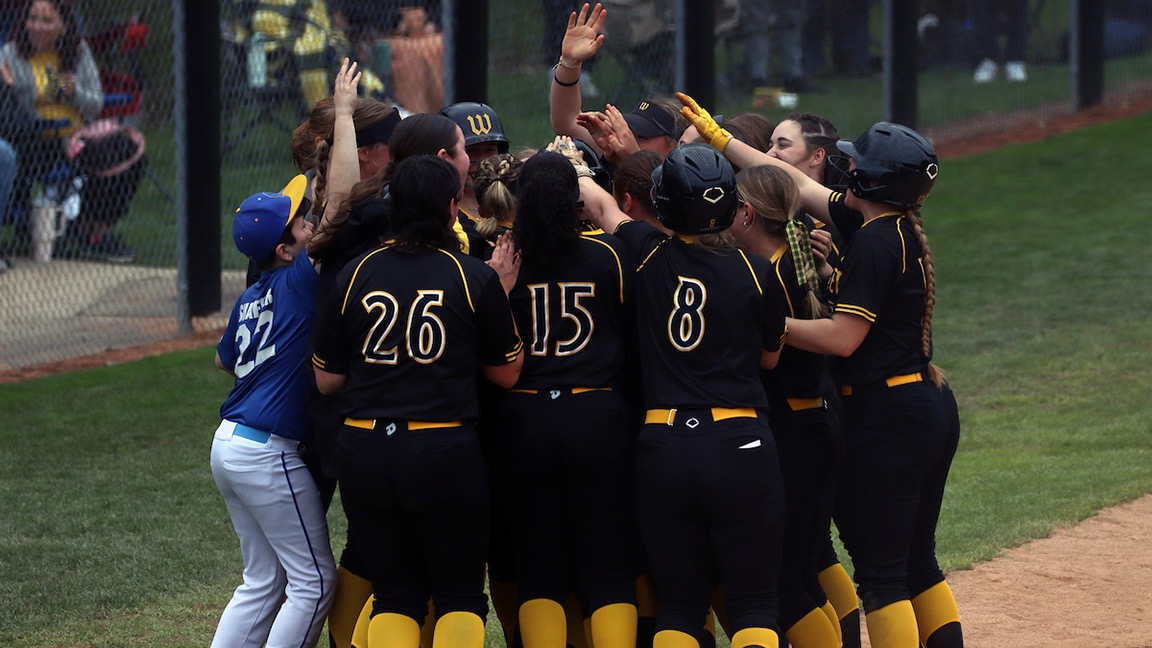 Softball team celebrates after walk off win