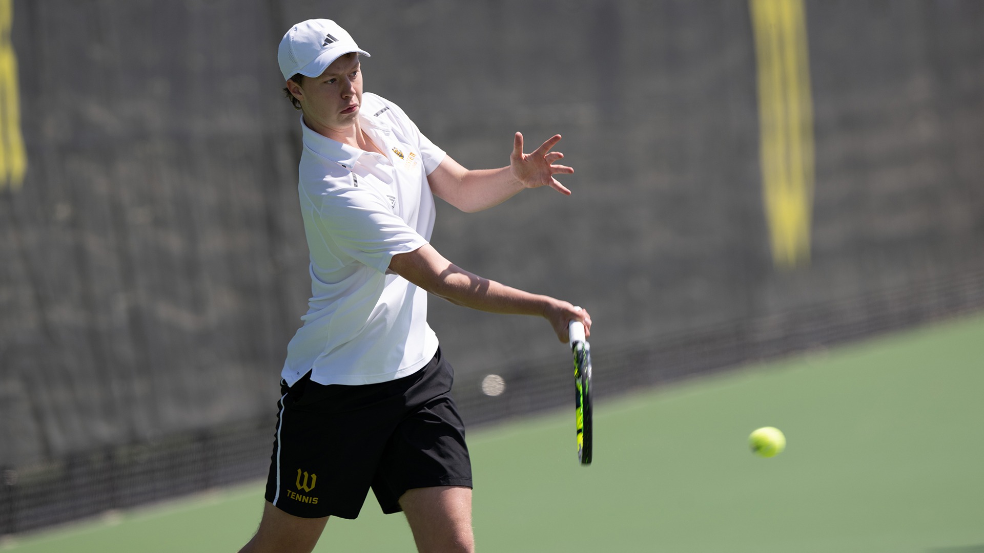 Ian Royse returns a serve in a 2025 match