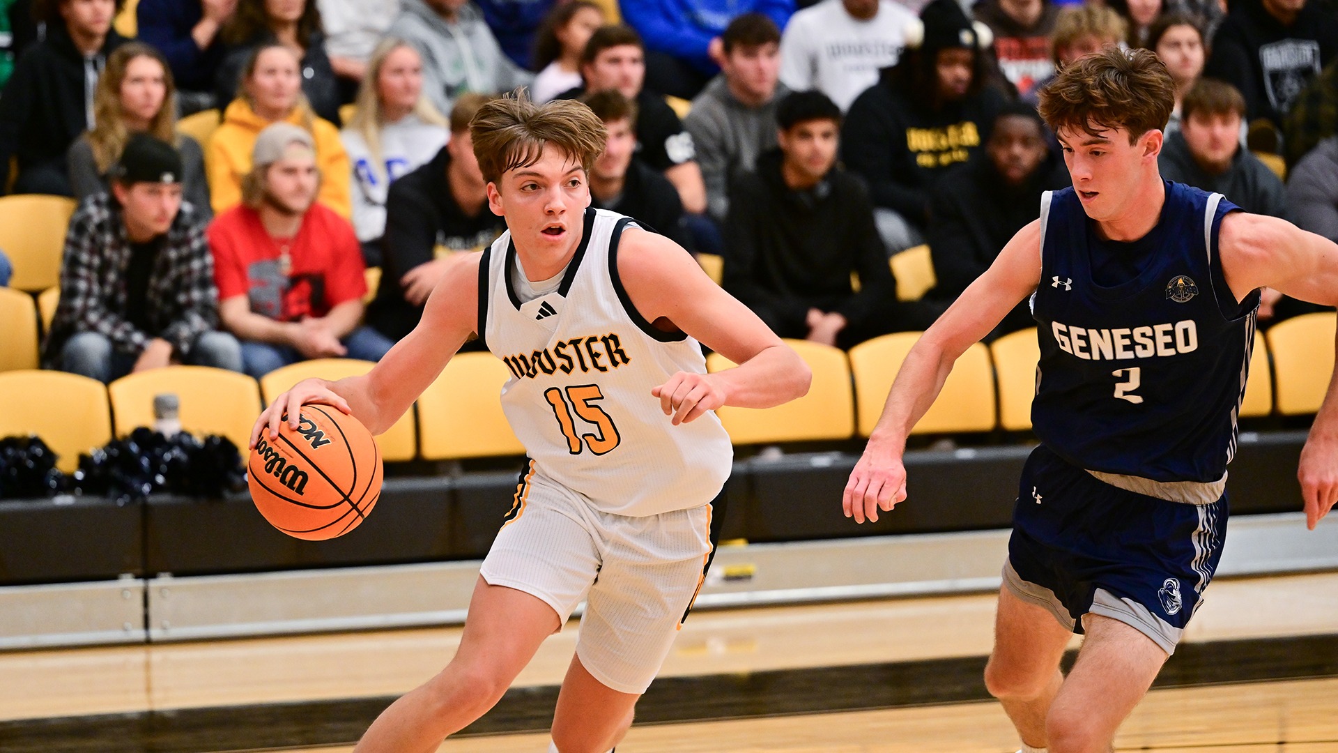 Breckman Oakley drives to the basket with the ball in a 2025 game against SUNY Geneseo.