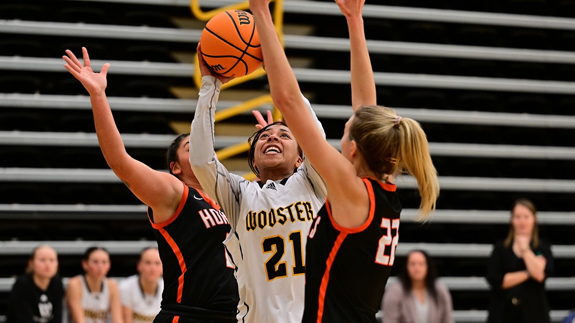 Ace Sturdivant tries for a layup between a pair of defenders