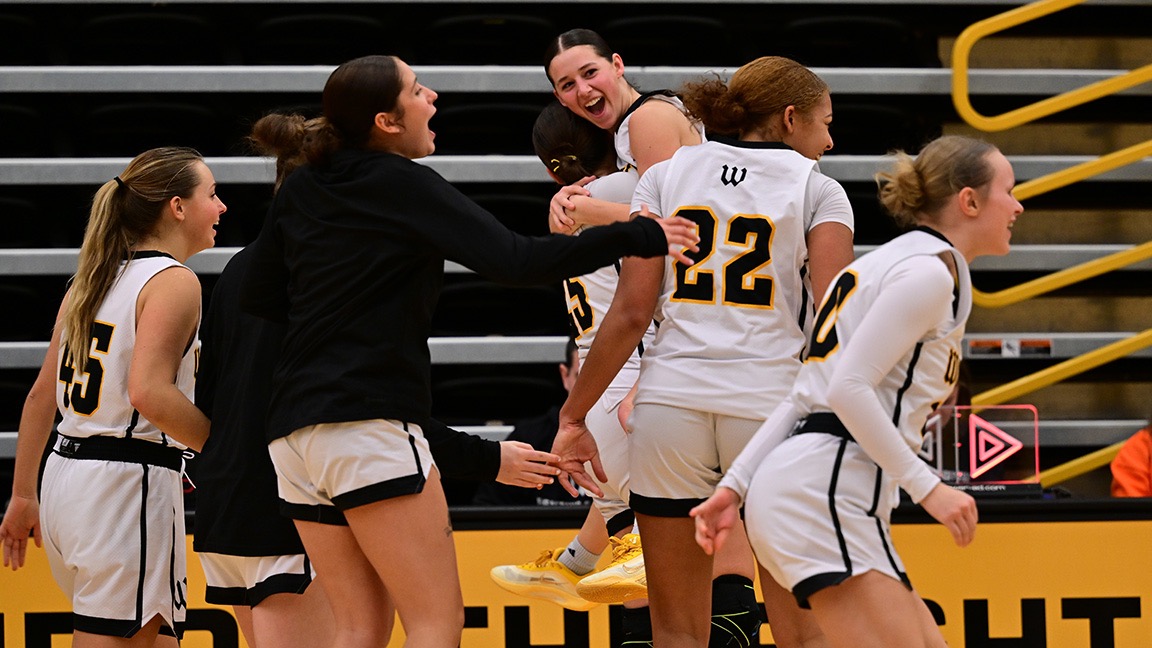 Seven players jump in excitement following a win