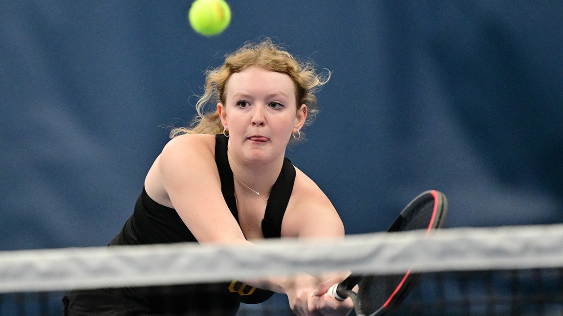 Elyse Errington volleys near the net