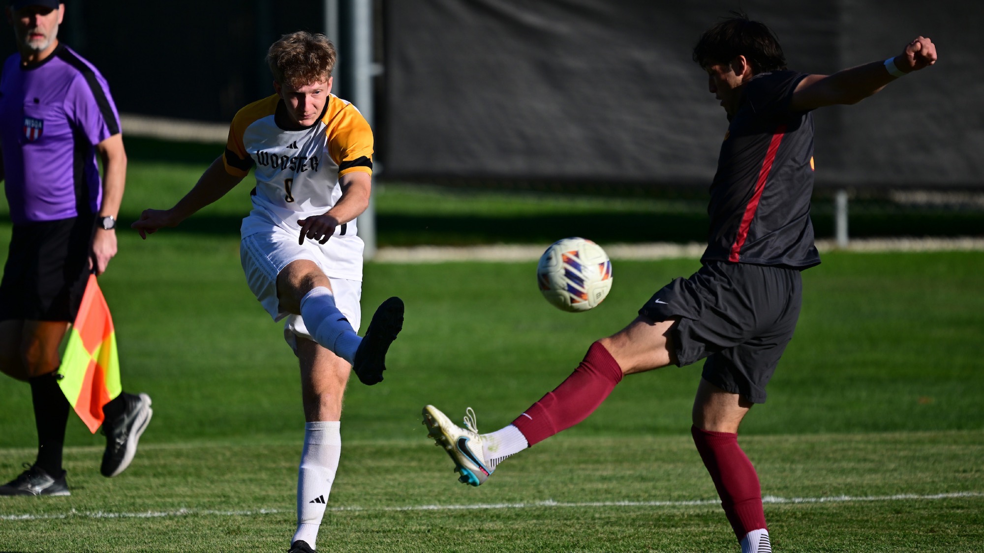 Robert Hillhouse kicks a ball past a defender