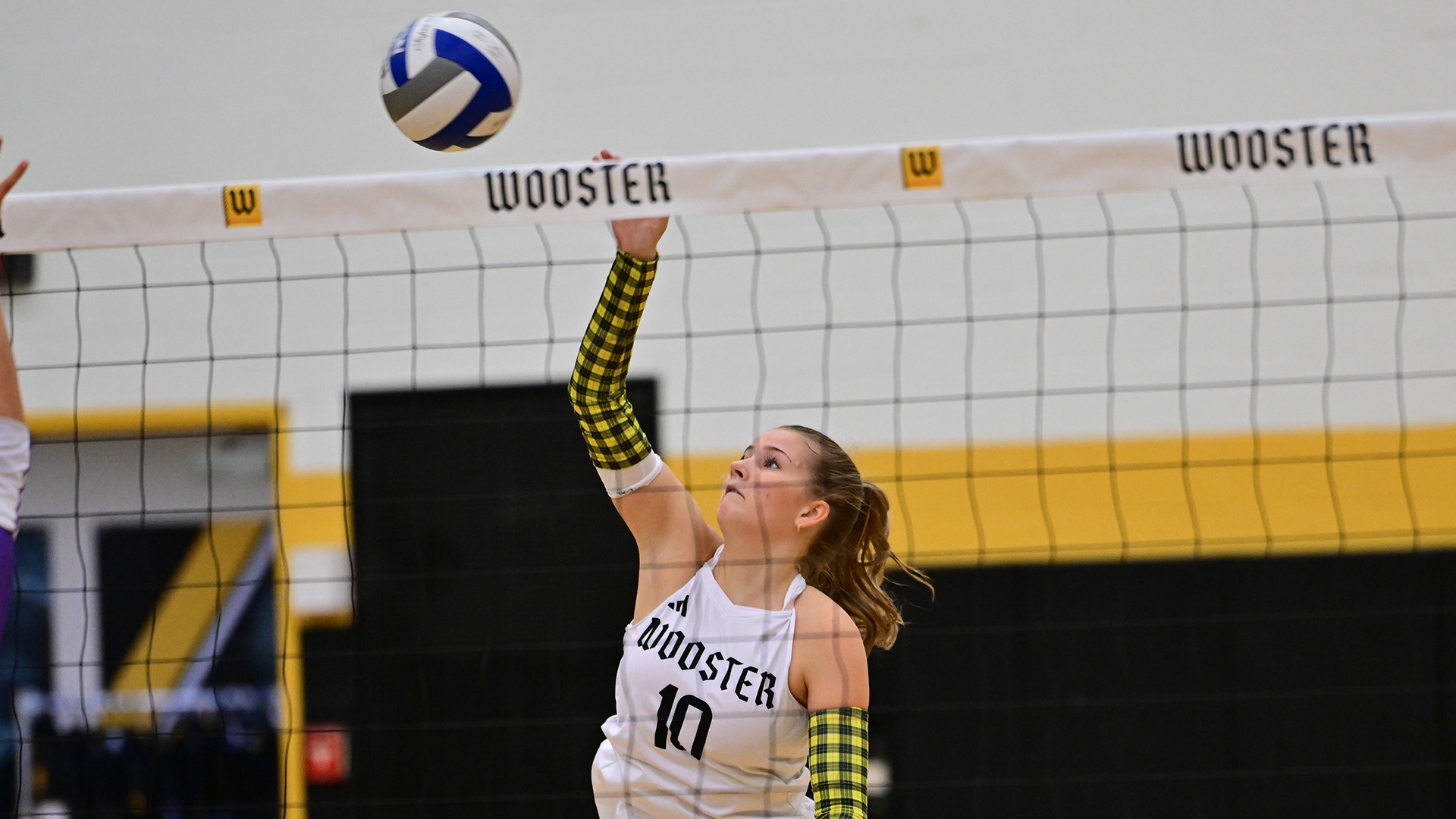 action photo of Claire Buchholz attacking the volleyball in a 2026 match