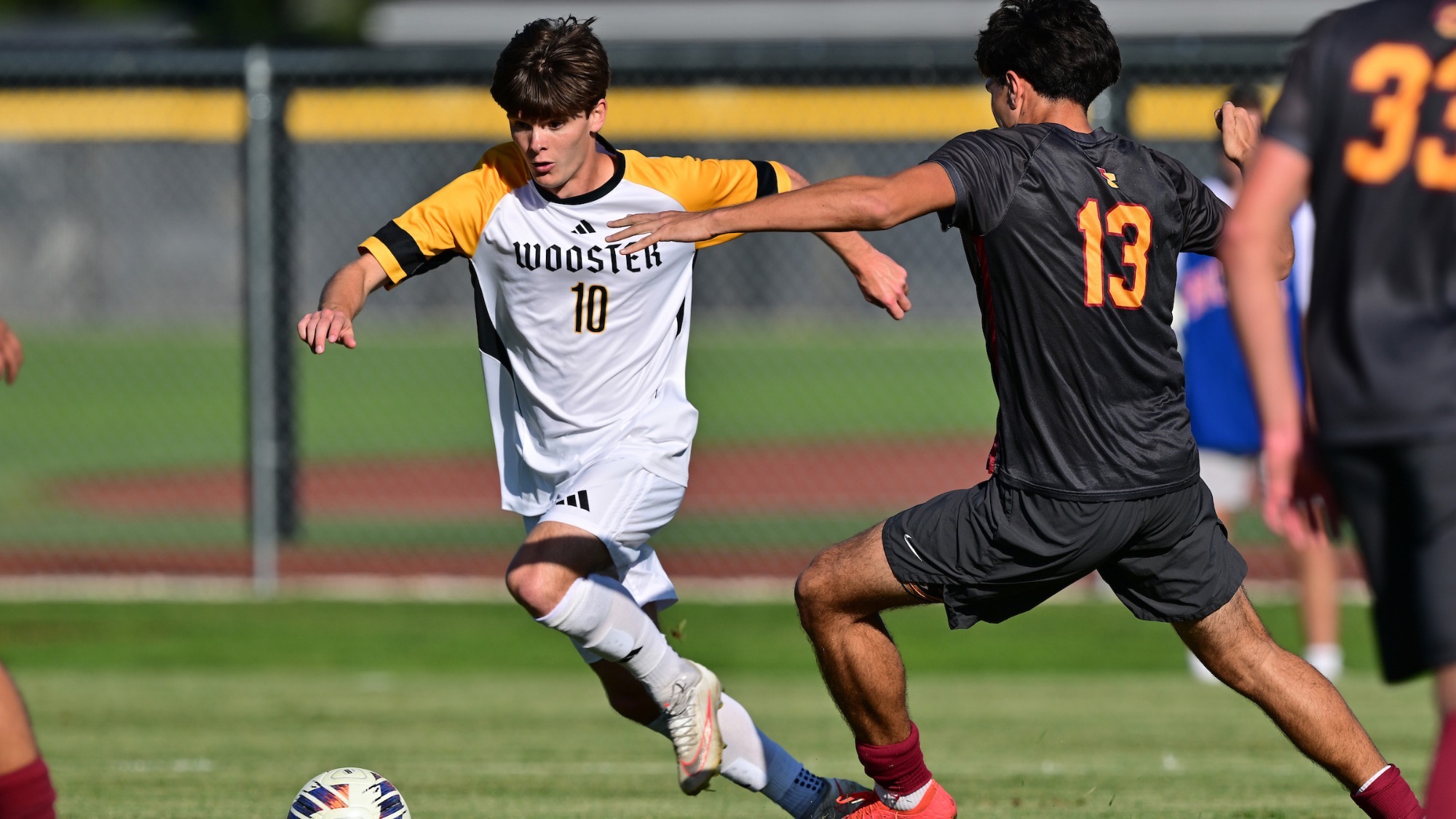 Connor Shea dribbles past a defender