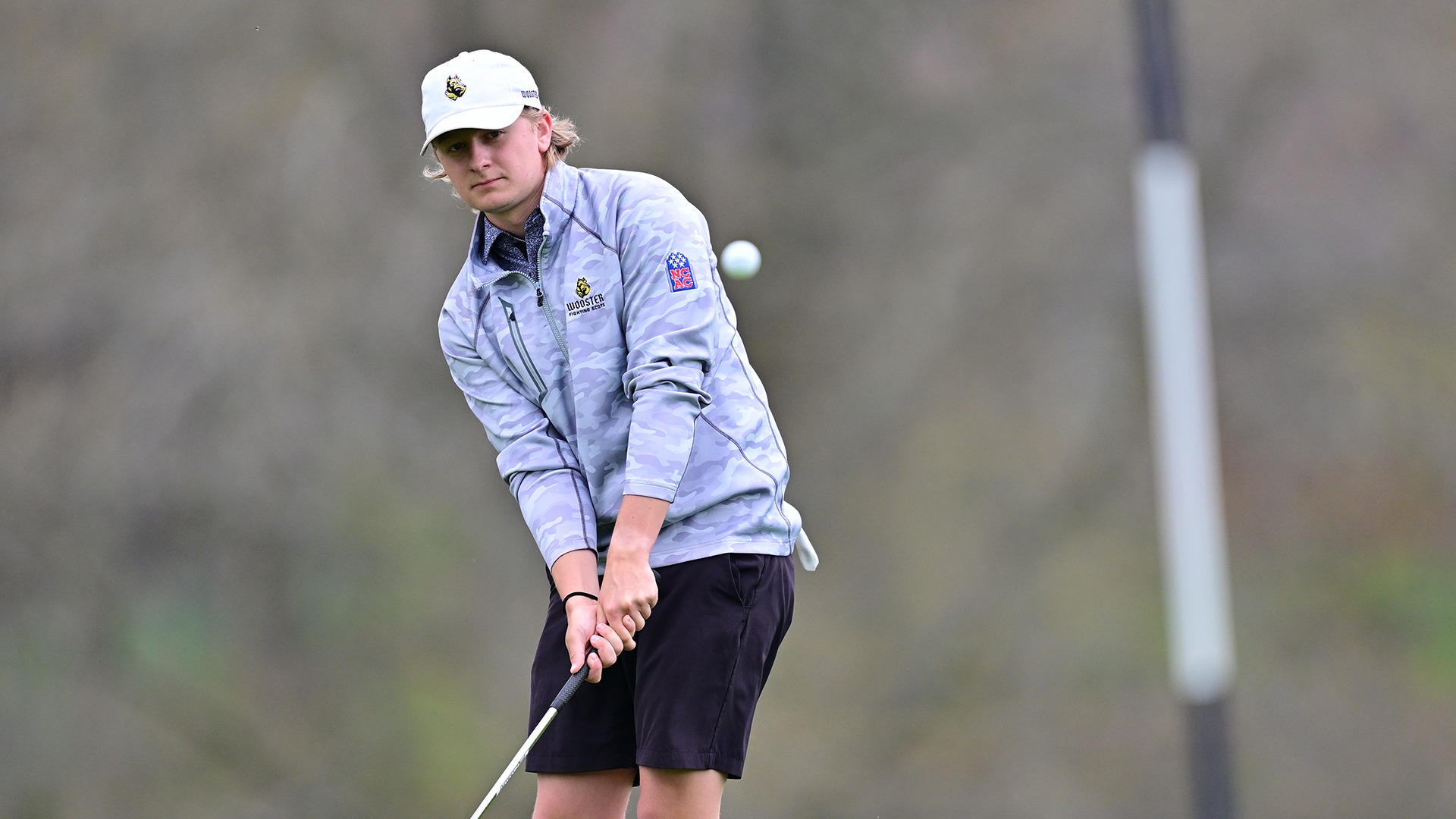 action photo of Andrew Carey watching his chip during the 2026 Nye Intercollegiate