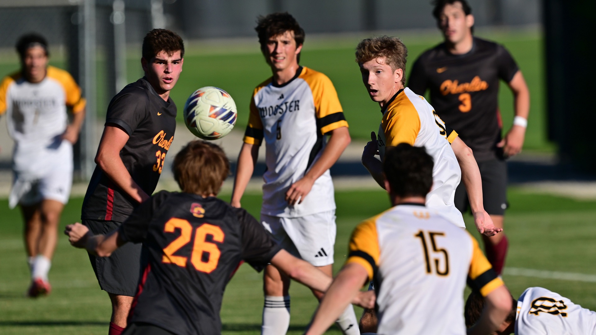 Robert Hillhouse looks at a ball in the air with players all around