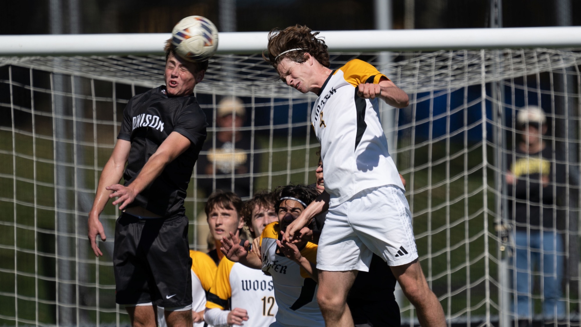 Nate Chartrand (r) and a Denison player (l) both go up for a header attempt