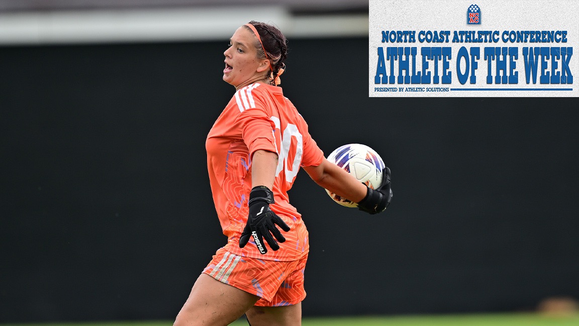Lucy Carlin rears back to throw with the soccer ball in her right hand. The NCAC AOTW logo is in the top, right corner.