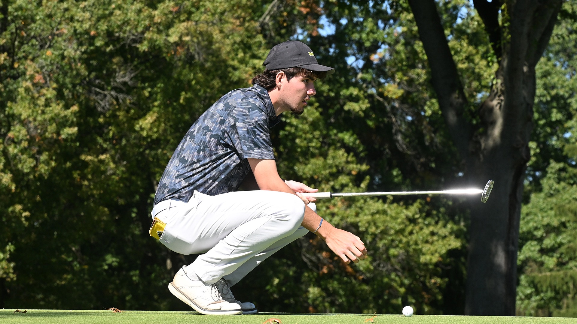 action photo of Florian Egger lining up at putt during the 2026 Blue Streak Invitational