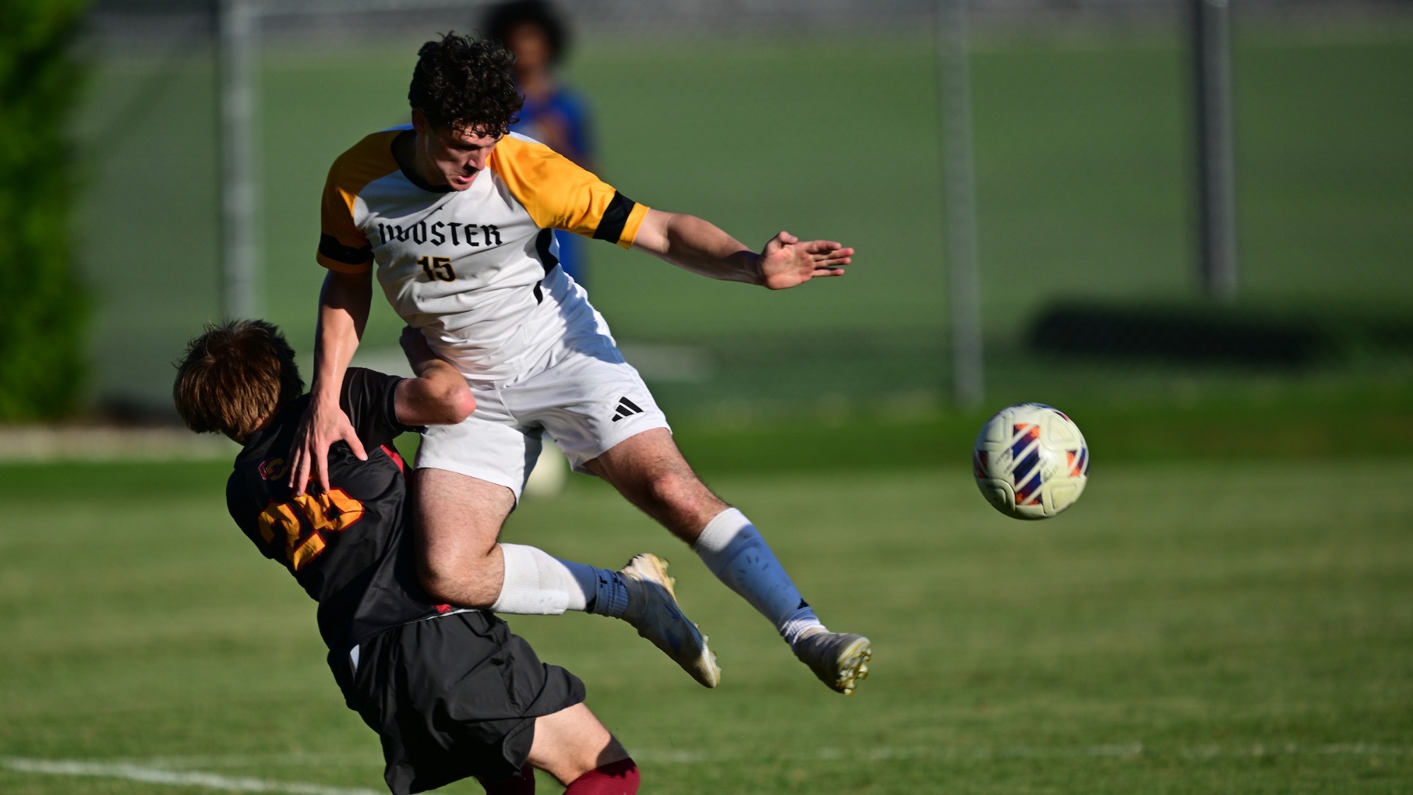 Connor Piero collides into an Oberlin defender with the ball within reach