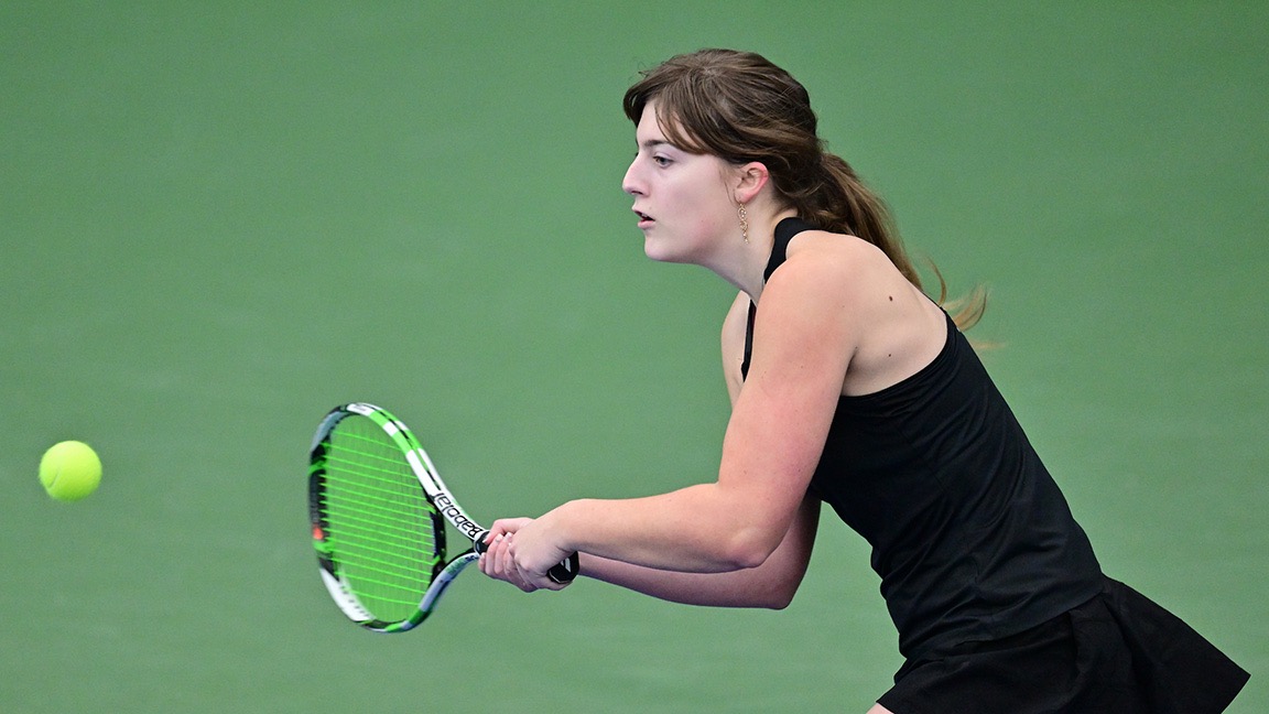 Jade Adkins prepares to hit a tennis ball