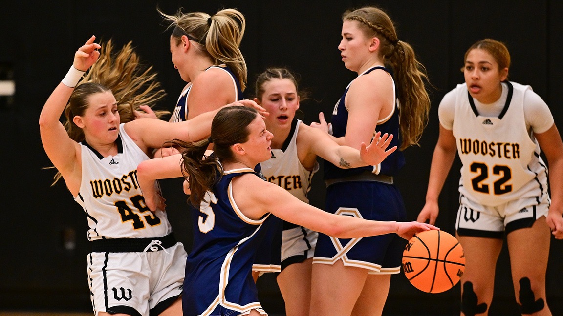 Abby Henegar, Emily Webb and Pink Sturdivant provide defense against a John Carroll offense.