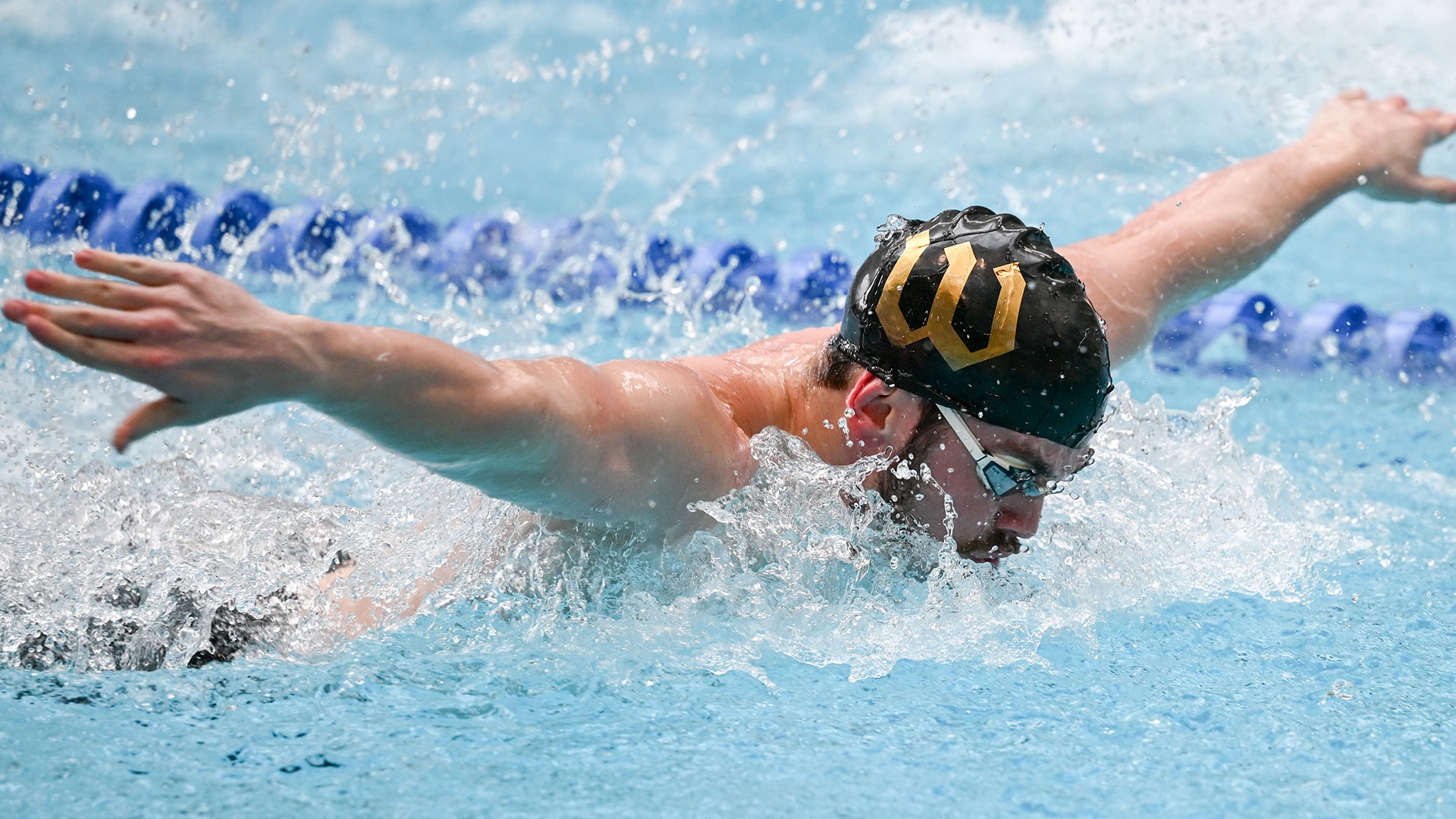 Callum Glover swims the butterfly at the 2025 Wooster Invitational