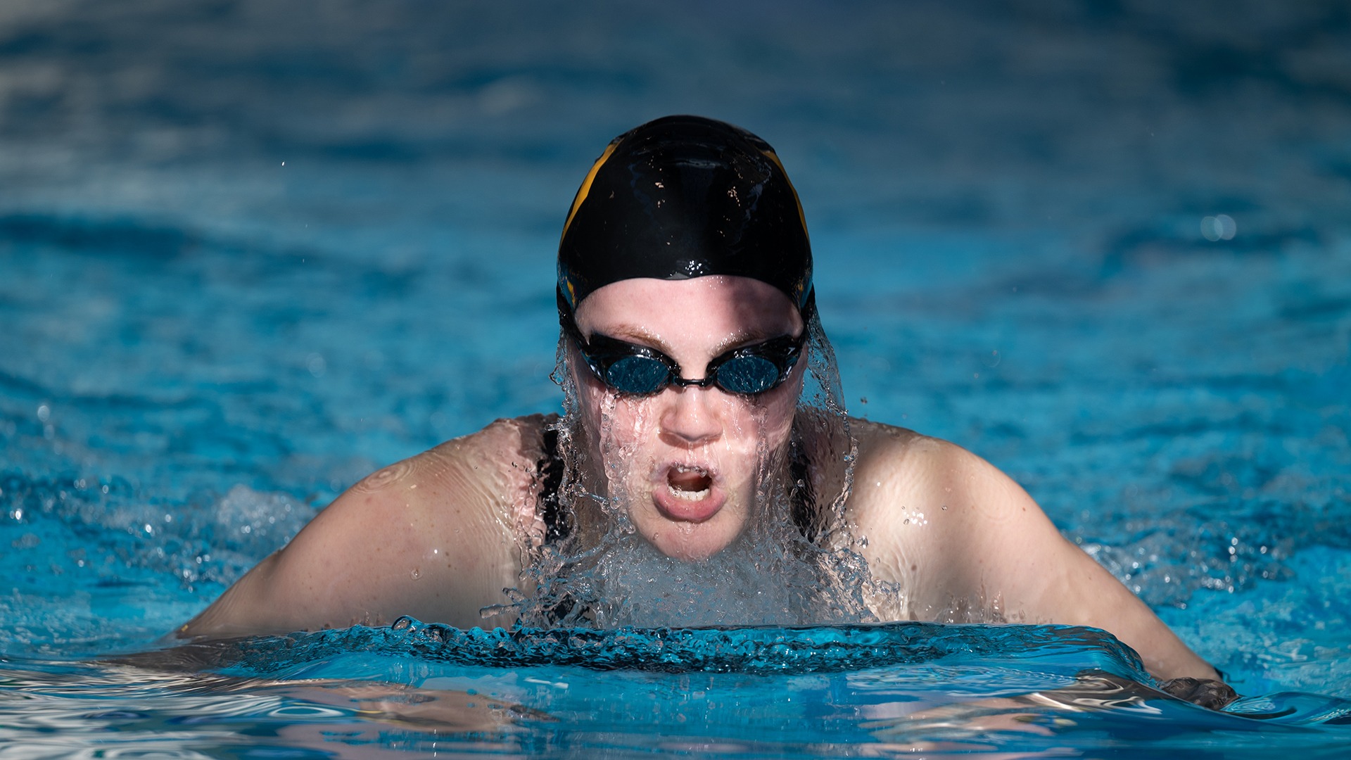 Elizabeth Theobald swims the breaststroke during an individual medley event at the 2025 Wooster Invitational