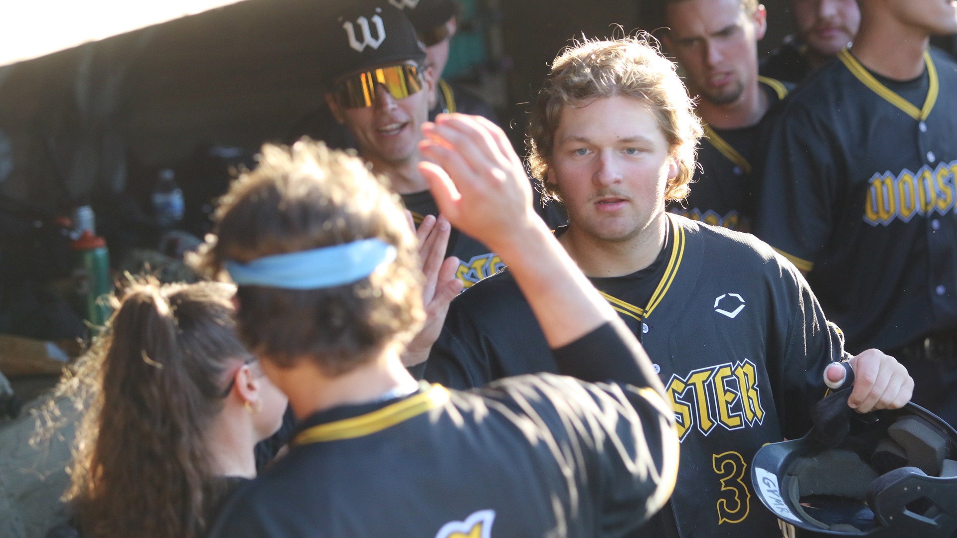 Zack Barienbrock is congratulated by a teammate during the 2025 NCAC Tournament.
