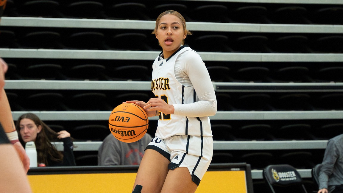 Pink Sturdivant dribbles up the court